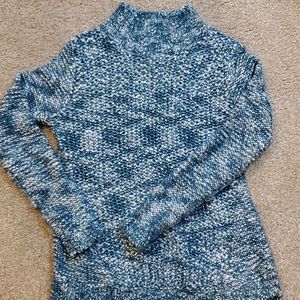 Sweater with slit opening on back